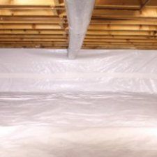 Crawl space encapsulated with white vapor barriers| Basement Doctor | Home Improvement