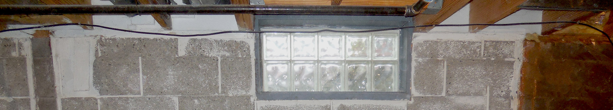 glass block windows in a cement block basement wall | glass block | basement doctor columbus