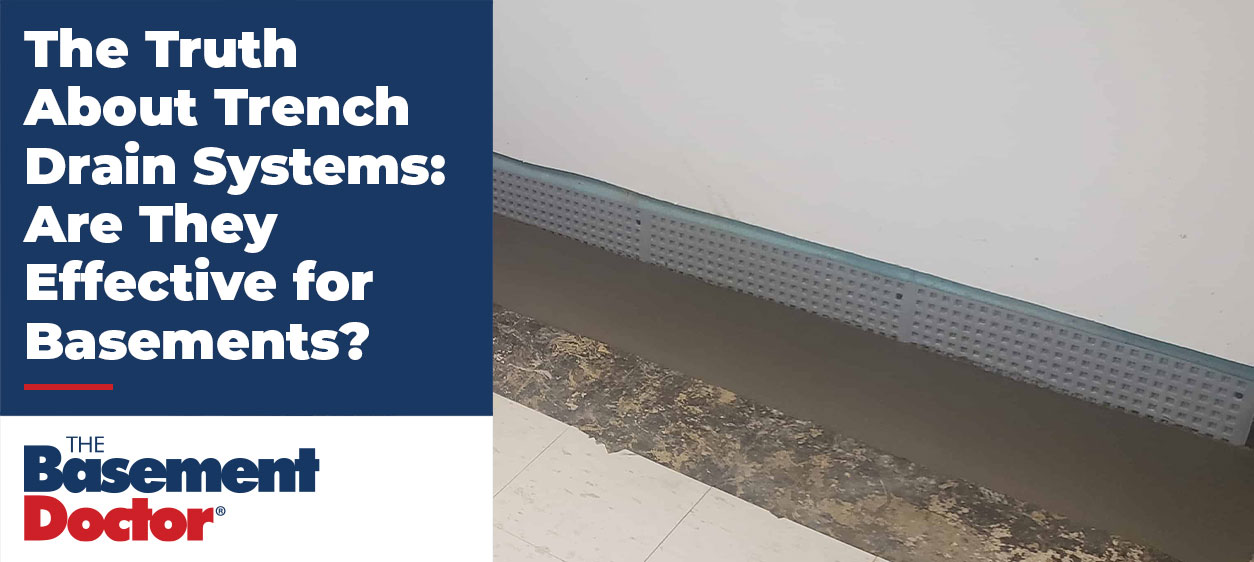 Basement trench drain system installed along the foundation wall, showing drainage channel and fresh concrete after waterproofing work.